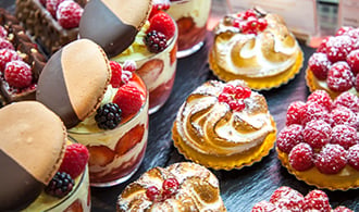 Rows of freshly made pastries and desserts.